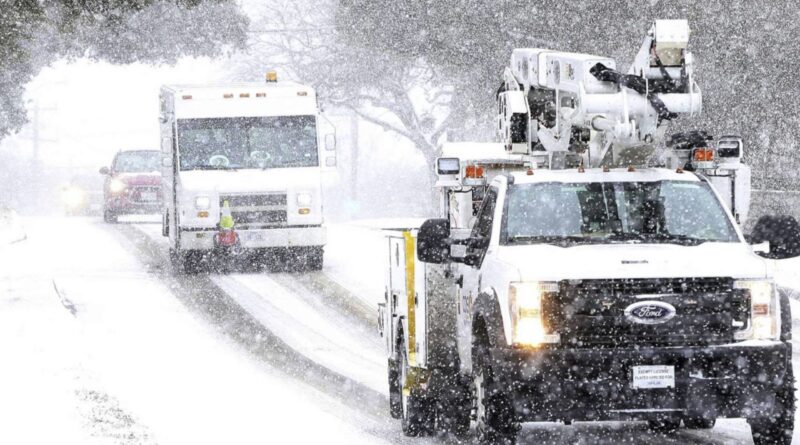Image of work trucks in a snow storm. Houston Chronicle: CEO of San Antonio electric utility fighting price-gouging for all Texans
