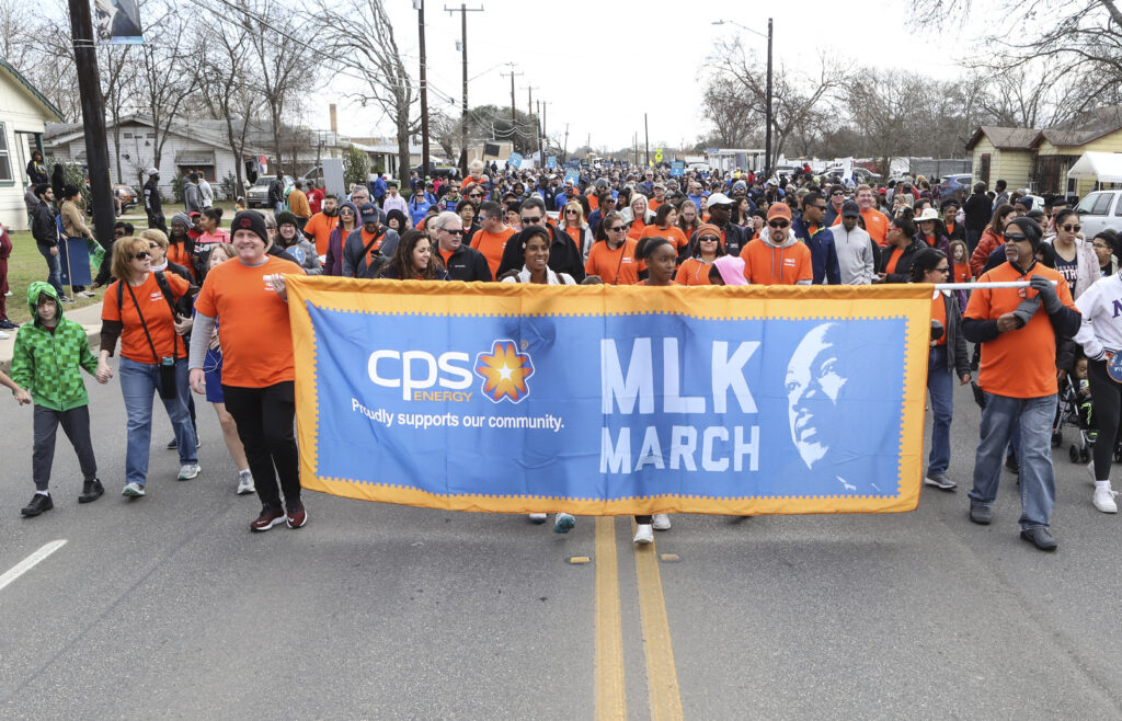 CPS Energy volunteers participate in the MLK march on the eastside.