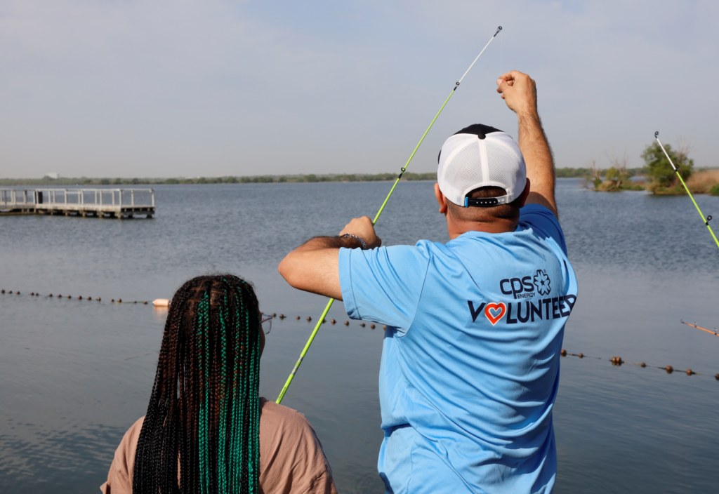 A photo of CPS Energy and participants fishing at the Kids Fish Event