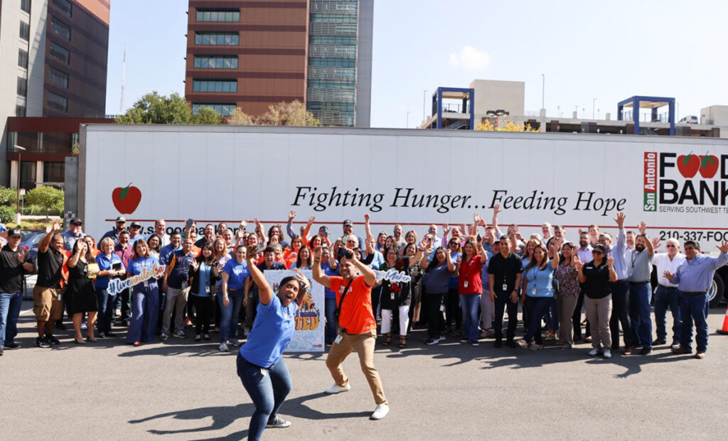A photo of CPS Energy crew posing with United Way staff during Food Bank event