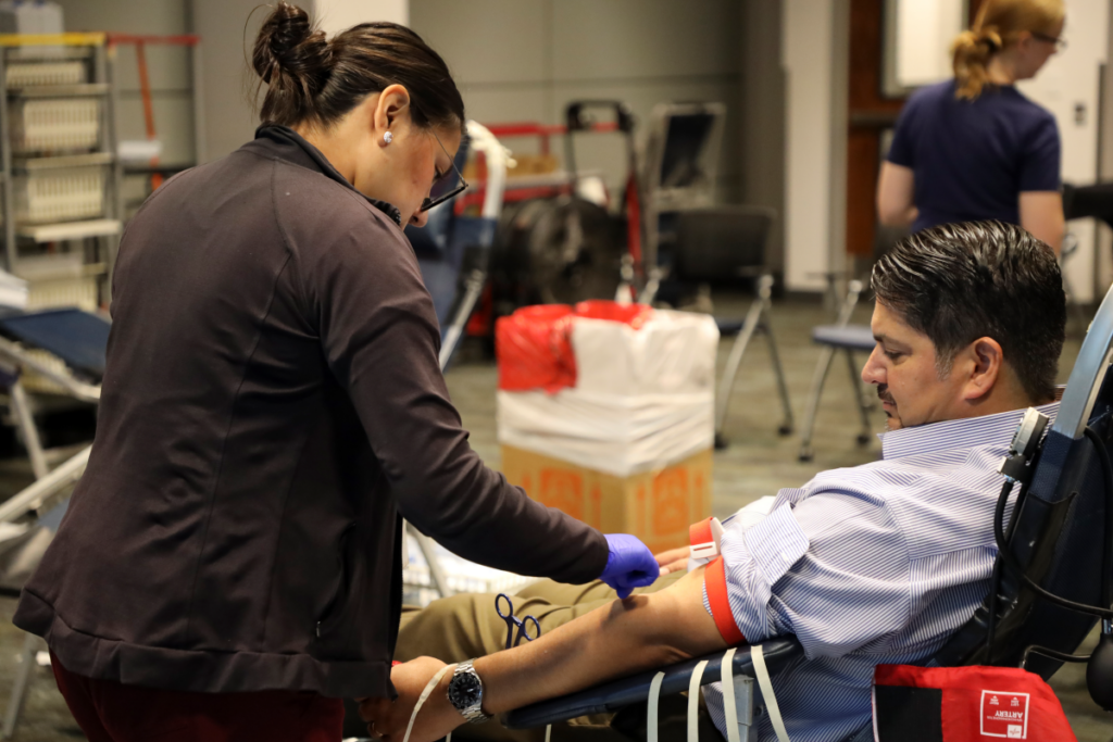 A photo of Rudy Garza, President and CEO of CPS Energy, donating blood during blood drive