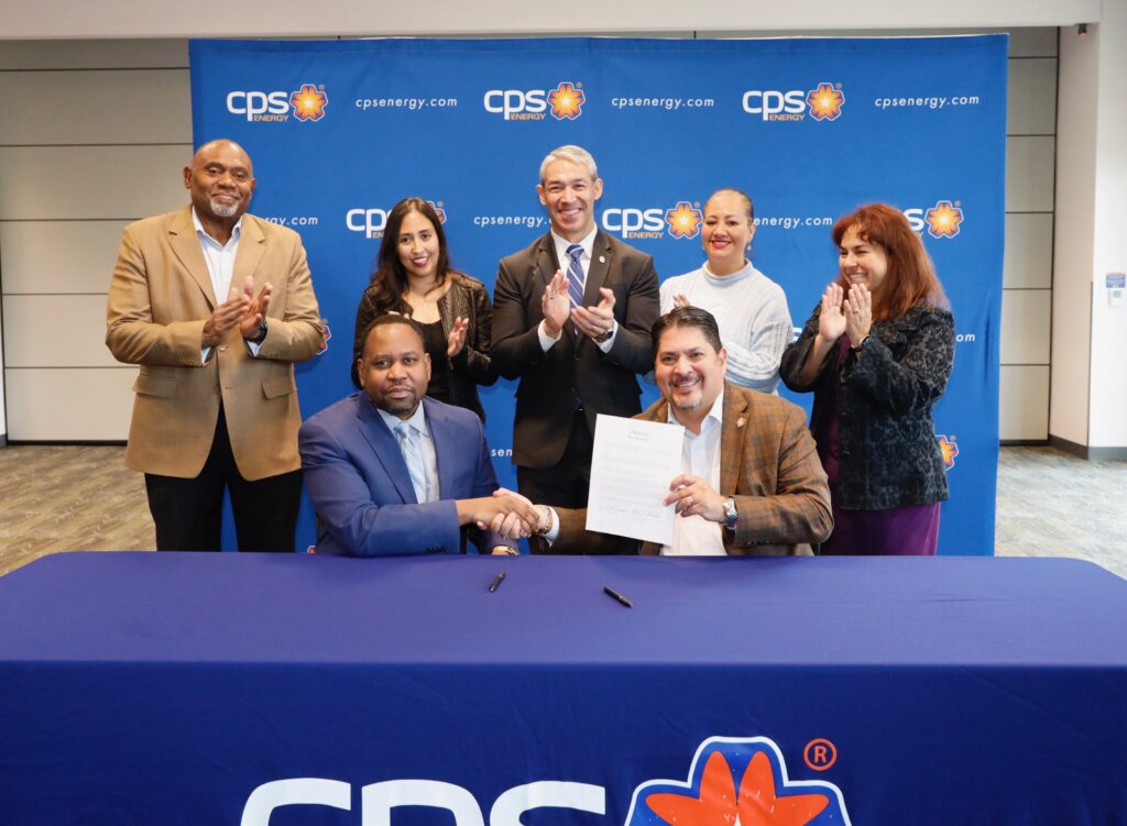 A photo of Rudy and GCI CEO Signing Solar agreement