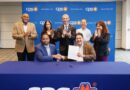 A photo of Rudy and GCI CEO Signing Solar agreement